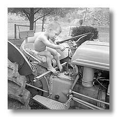 Young Tyler on 9N Tractor Image Young Tyler on 9N Tractor Image